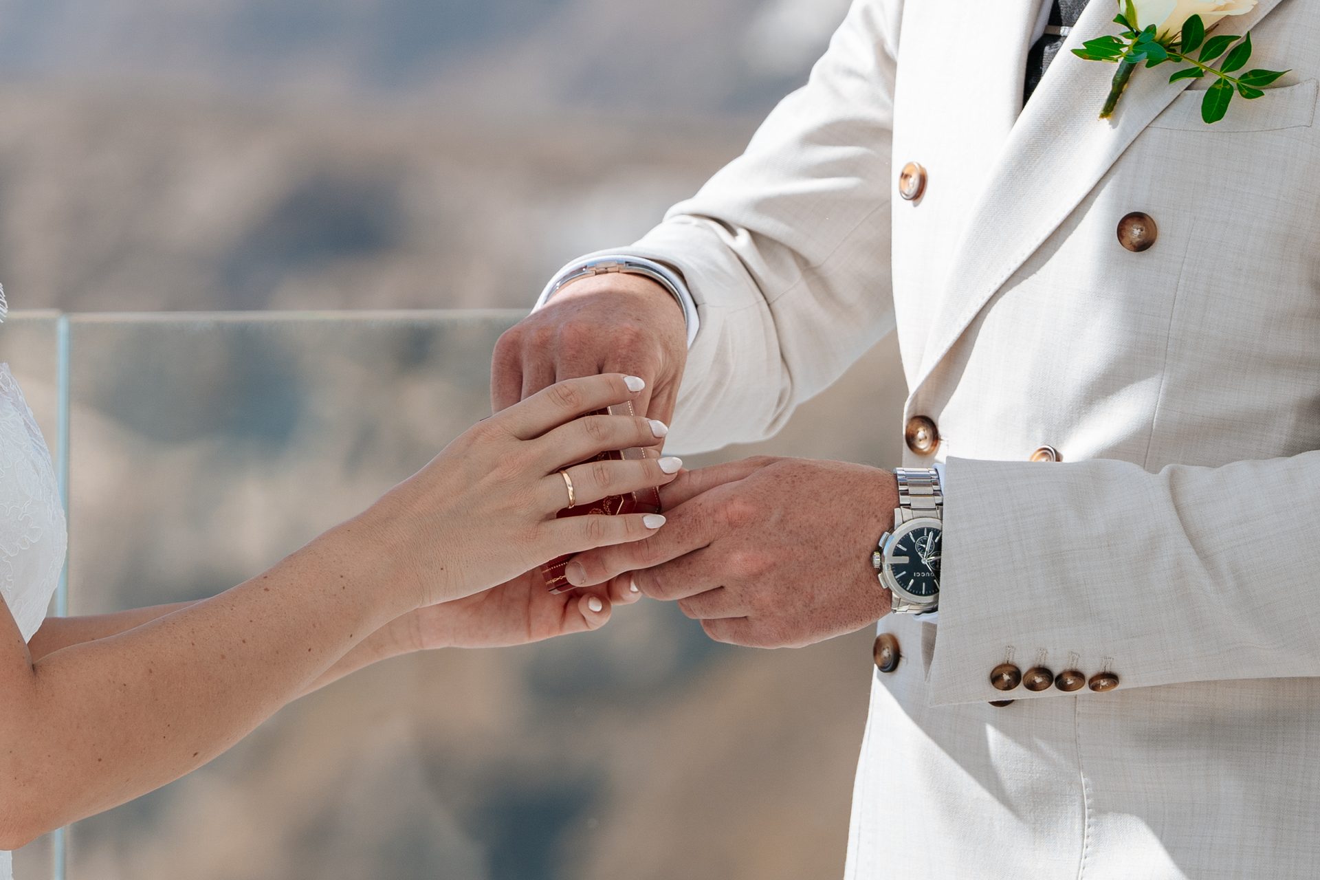 Clifftop wedding ceremony above the Santorini caldera, photographed by wedding photographer Alexandros Sirigos