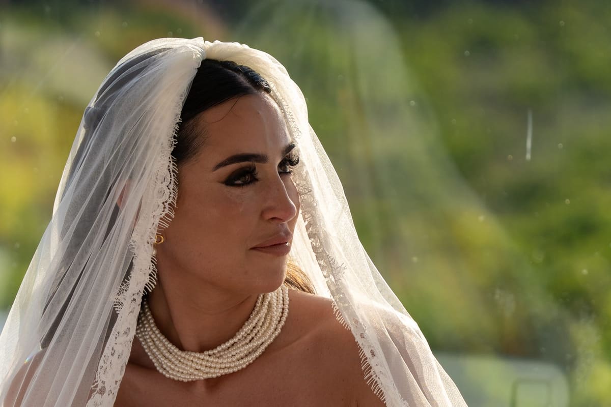 Bride portrait with a pearl-edged veil at a Santorini wedding